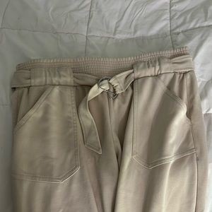 Cream-colored cuffed pants